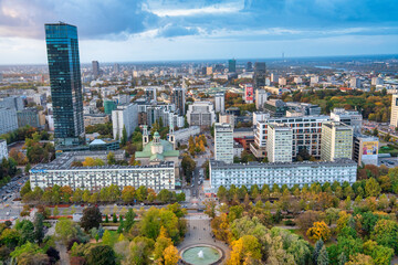 Aerial daytime view of Warsaw city showcasing modern skyscrapers and urban streets