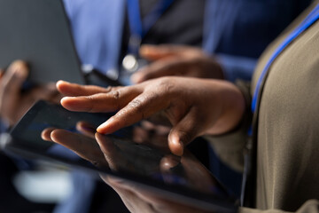 Coworkers team meeting in the factory to handle solar power production, showing teamwork in manufacturing process of photovoltaics. Green renewable energy system management in plant.