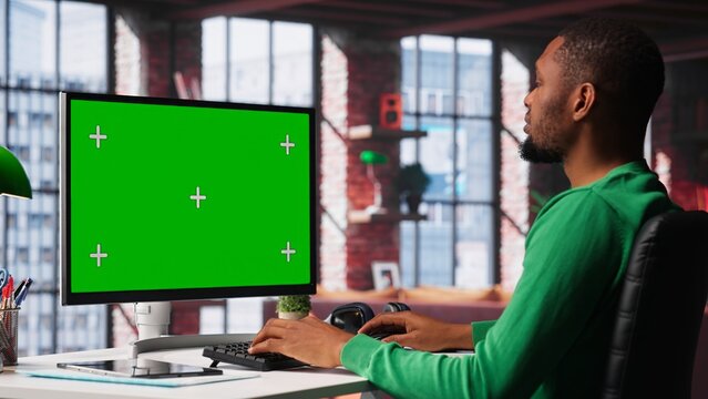 Freelancer completing spreadsheets on isolated chroma key on pc, entering data and calculating totals. Remotely working accountant analyzing figures, using spreadsheet software. Camera A. - Powered by Adobe