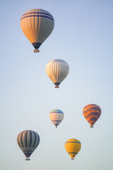 Obraz premium Hot Air Balloons over Cappadocia Valleys in Nevsehir, Turkiye