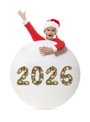 Boy dressed as Santa Claus holding Christmas poster with 2026 number made from evergreen branches on white background