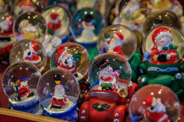 Fototapeta premium Snow globe Christmas ornaments at the Colmar Christmas Market in Alsace, France