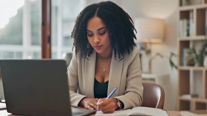 Focused Woman Working on Laptop and Taking Notes in Office. - Powered by Adobe