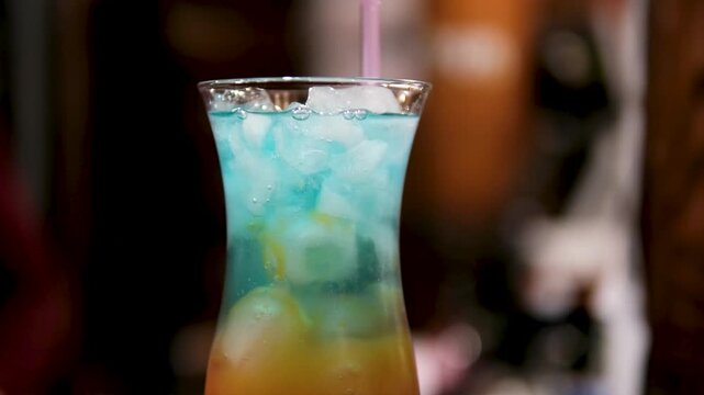 Blue Hawaiian Cocktail drink Perfect for beach parties or island getaways,nrefreshing and exotic libation that embodies the spirit of the tropics. High quality 4k footage