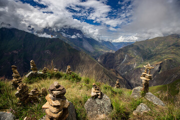 Steps of gratitude and connection.These apachetas, stone cairns built by trekkers, honor the Pachamama (Mother Earth). Each stone represents a moment, a wish, or a blessing left behind on the journey 