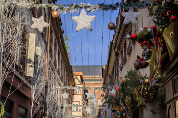 Obraz premium Festive decorations on half timbered houses, Strasbourg Christmas Market, France