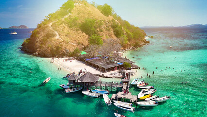 Drone view of Pulau Kelor surrounded by crystal clear waters in Komodo archipelago, Indonesia