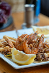 Enjoying a lunch outdoors at an Italian restaurant with traditional dishes on the table