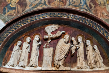 Sculpture (19th century) of Presentation of Jesus in the temple by Mary and Joseph.