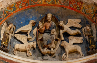 Stone sculpture (13th century) of The four evangelists with Jesust: Luke and the bull, Mark and the lion, John and the eagle, Matthew and the angel.