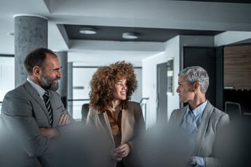 Diverse business professionals having informal meeting in office