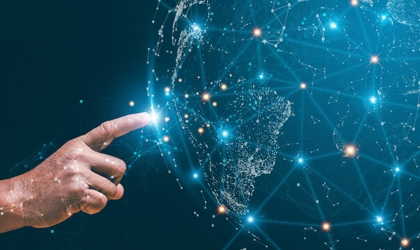 Global network connection concept. Hand touching a glowing digital network over a world map. Worldwide communication, data exchange, technology integration and the future of global connectivity.