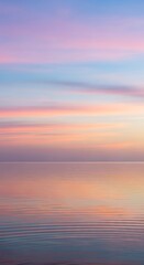 Fototapeta premium Serene gradient over tranquil water surface with soft pastel colors