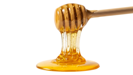 Golden honey dripping from a wooden dipper isolated on transparent background