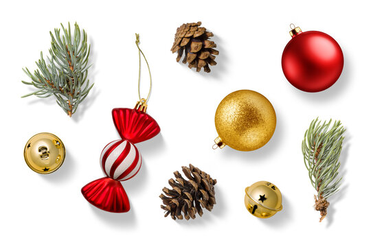 Collection of Christmas-themed elements on a transparent background, featuring a red and white candy cane, gold jingle bells, spruce branches, pine cones, red and gold bauble and candy ornament. 