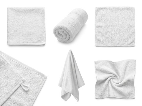 Collection of white towels in different shapes and arrangements on a white background