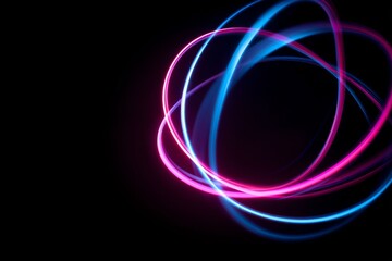 Neon pink and blue firework rings glowing against a dark sky.