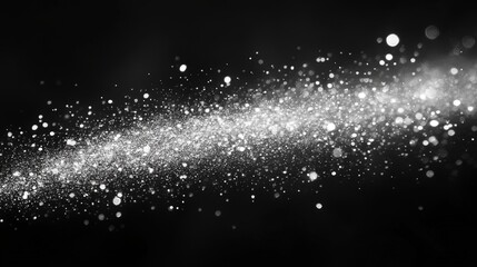 Obraz premium A dramatic photograph featuring a flowing stream of sparkling white lights set against a deep black background. The image evokes a sense of wonder and ethereal beauty.