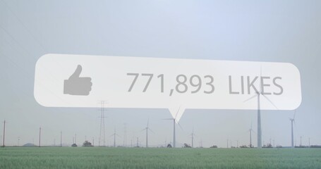 Floating speech-bubble hovering crop field, showing thumbs-up 771,893 likes, turbines