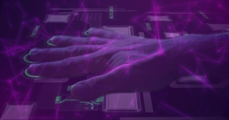 Pressing male right hand activating sensor pads on lit console with sleeve cuff, green nodes