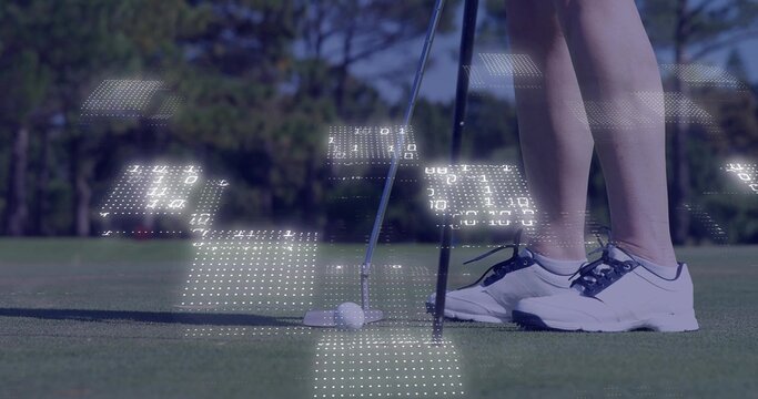 Aiming golfer's putter behind golf ball on green, showing white shoes, digital panels, copy space - Powered by Adobe