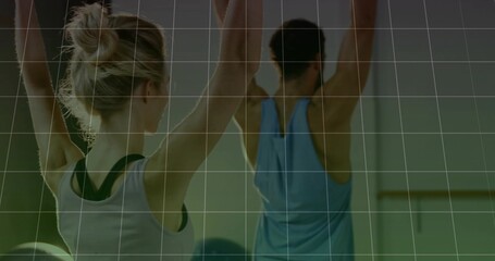 Stretching woman in white tank dark-straps and man in blue top, studio, ball mirror barre grid