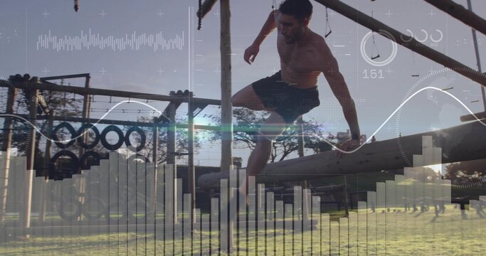 Vaulting shirtless athletic man clearing wooden beam at training park with tires, HUD overlay