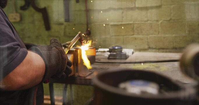Operating cutting torch, welder in thick gloves cutting metal on bench, sparks, copy space - Powered by Adobe