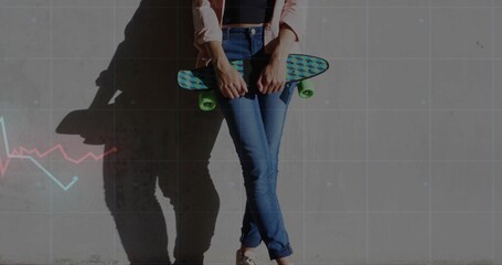 Leaning woman holding teal skateboard at concrete wall in rolled-jeans casting shadow, grid overlay