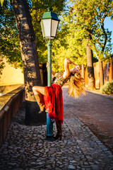 elegant woman exploring the gardens of estoi palace in the algarve