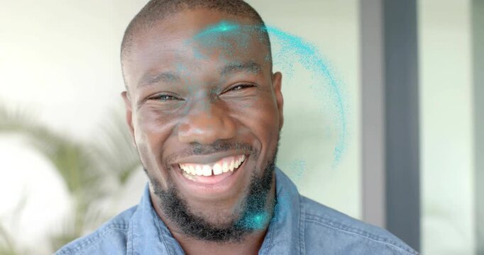 Man smiling then laughing, turquoise particle halo appearing near forehead, showcasing technology