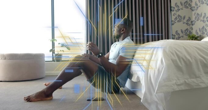 Man holding phone near window, sparking tech grids around him evolving into gold beams seeking calm