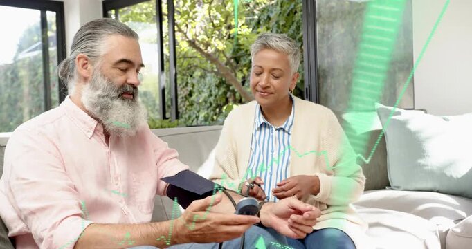 Woman placing BP cuff, couple comparing monitor readings while green overlay showing health data