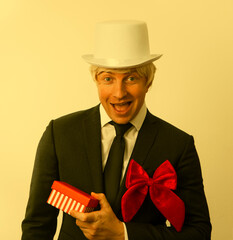 man with gift box. Man emotion face happy. Business concept. Christmas time. Wokring