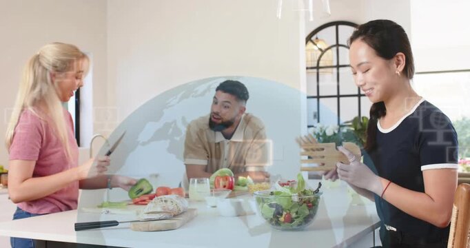 Pink woman chopping, man leaning, navy woman tossing salad, cooking, talking sparking digital globe