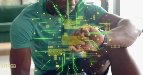 Man holding smartphone and tapping watch, phone emitting code overlays syncing fitness data - Powered by Adobe