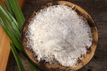 Traditional Malaysian desert Nonyah Kuih making preparing ingredients panadn leaf shredded coconut...
