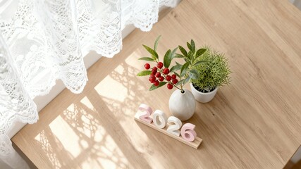 2026 New Year Vision: Sunlit Window Plant Pot Decoration on Table, Symbolizing Vitality and Future Hope for Home Gardening Interior Design.
