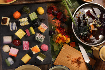 Traditional Malaysian desert Nonyah Kuih making preparing ingredients panadn leaf shredded coconut...