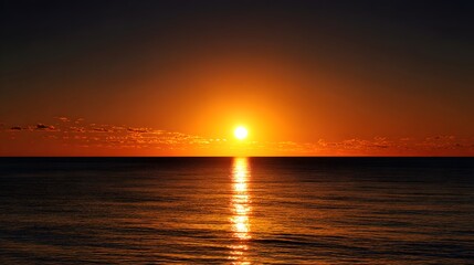 Fototapeta premium Golden Sunset Over Calm Ocean Waters with Reflective Sunlight.