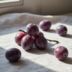 Plate of fresh red grapes on a wooden table