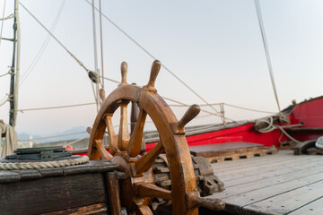 Vintage Wooden Ship Steering Wheel on Sailboat Deck 