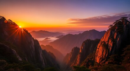 Golden sunrise over the huangshan mountains in china with sun rays