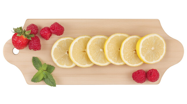 Fresh fruits and lemon slices on a light wooden cutting board with transparent background