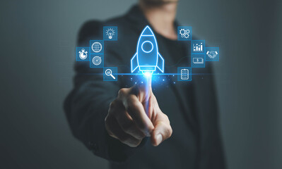 A business professional launching a digital startup concept with a glowing rocket icon, symbolizing innovation growth technology strategy and successful business development in the modern digital era.