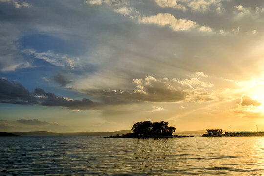 Erdek, Turkey - February 8, 2024 : Erdek Town harbor with ships at sunset