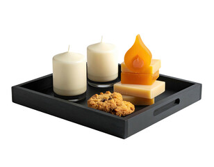 A tray holds candles, soaps, and a cookie, all bathed in soft, warm light