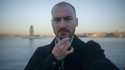 Man Taking Selfie with Cityscape in Background