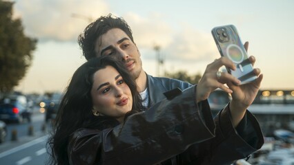 Couple Taking Selfie Together at Sunset