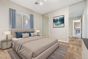 A cozy bedroom with a comfortable bed, TV, and spacious closet